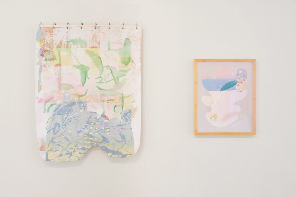 Two pieces of artwork hung side by side on a gallery wall.