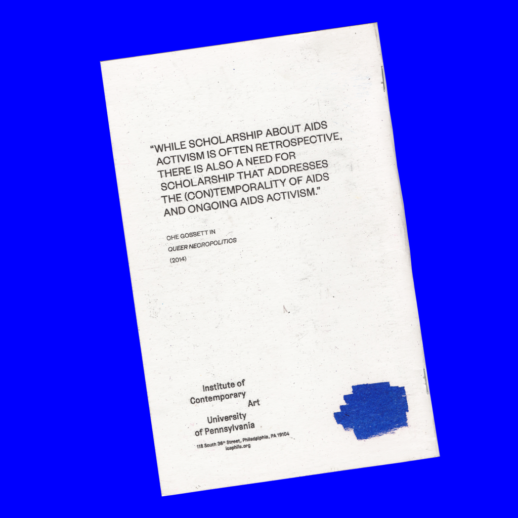 The back cover of a slender book against a blue background.