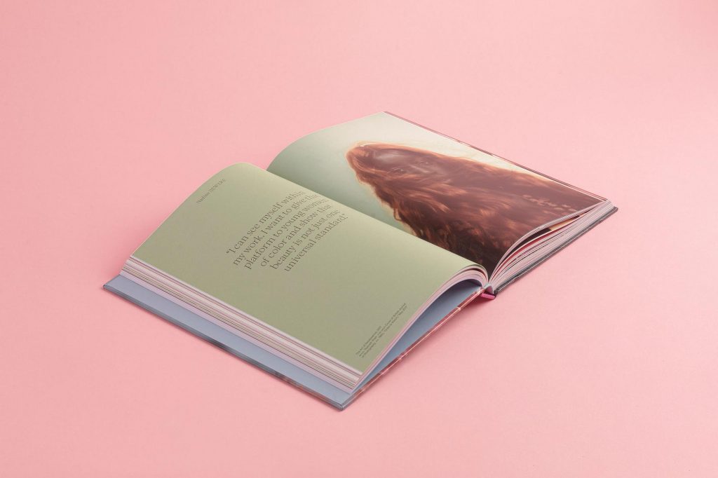 An open book showing a photograph on one side and text on the other