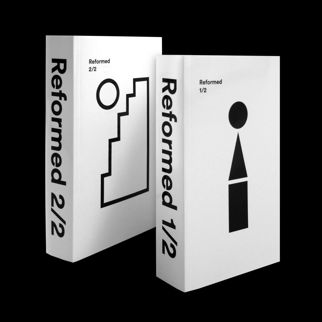 Two books sitting next to each other that say "Reformed 1/2" and "Reformed 2/2"