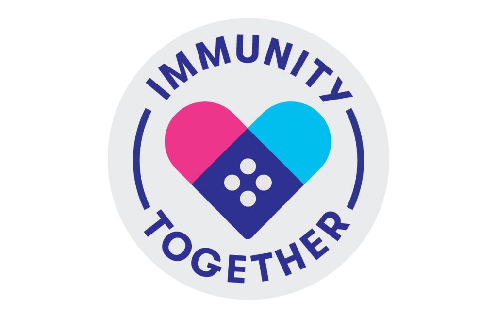 A white sticker with English text around a symbol of two bandaids forming a heart.
